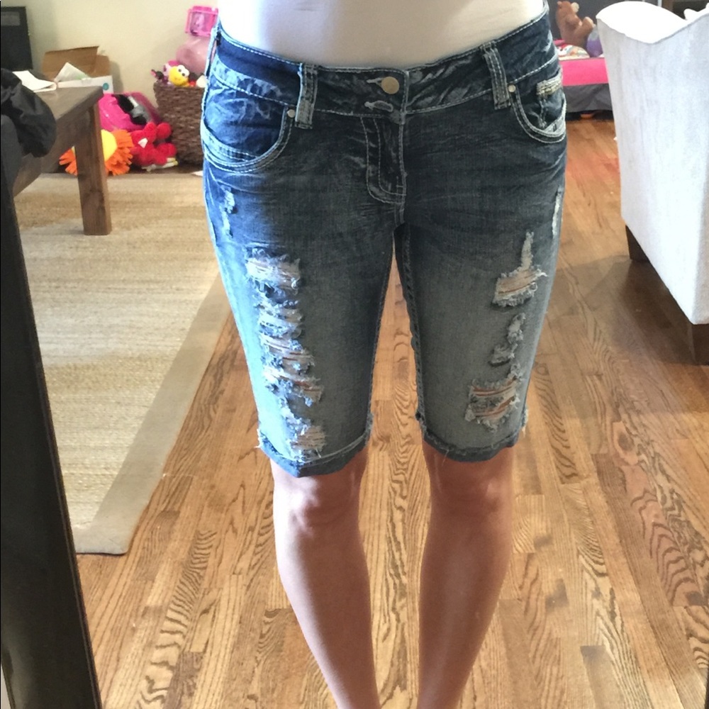 Size 7 distressed long shorts.